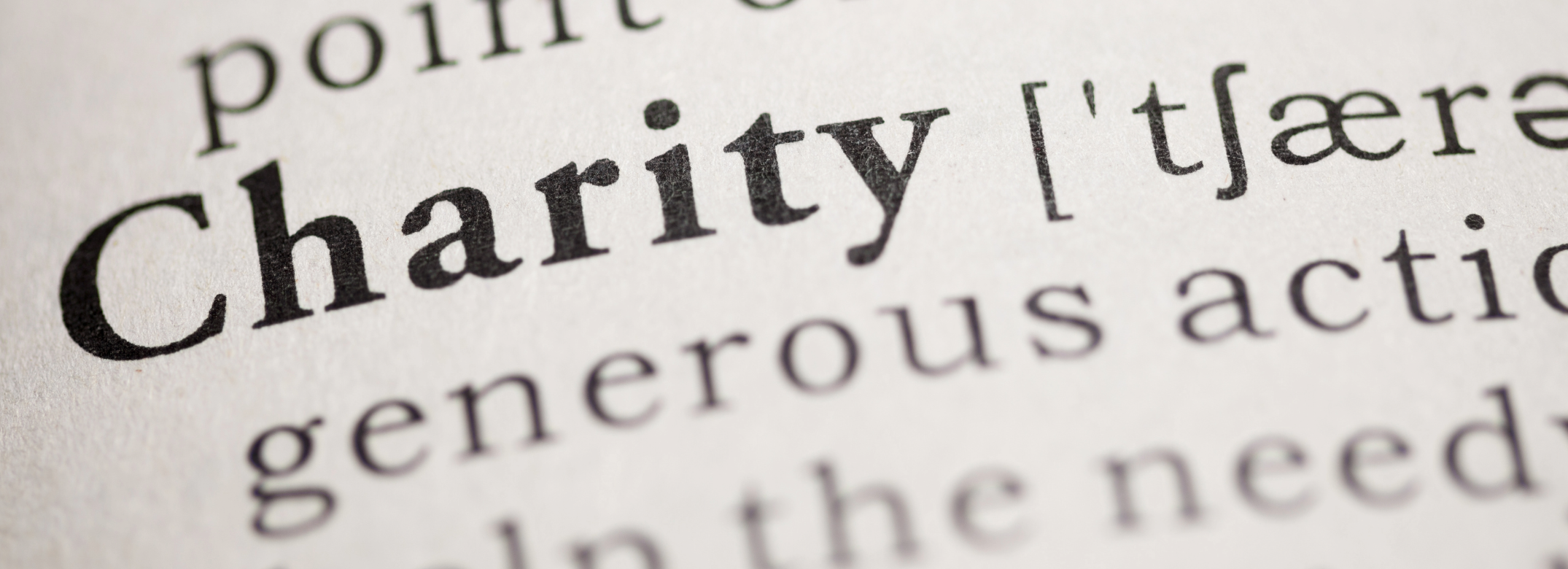 Close-up of dictionary entry for 'Charity'