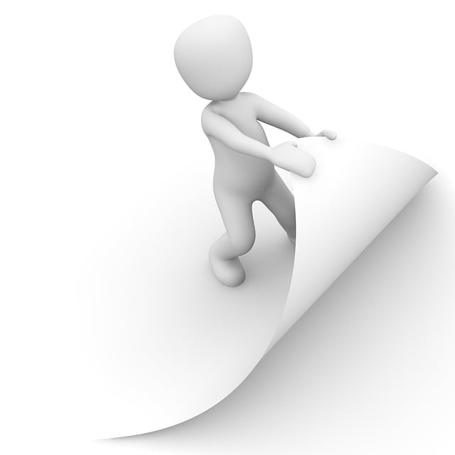 Human figure turning the corner of a white page